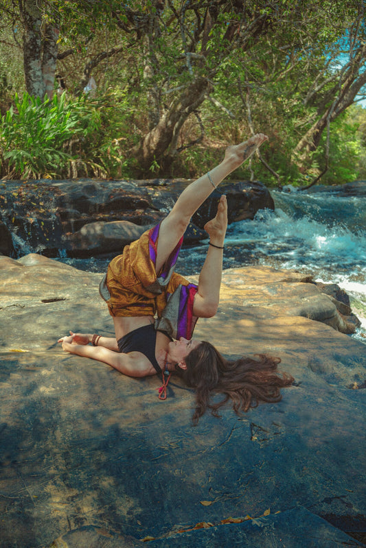 girl doing yoga pose in forest-mikkoa yoga