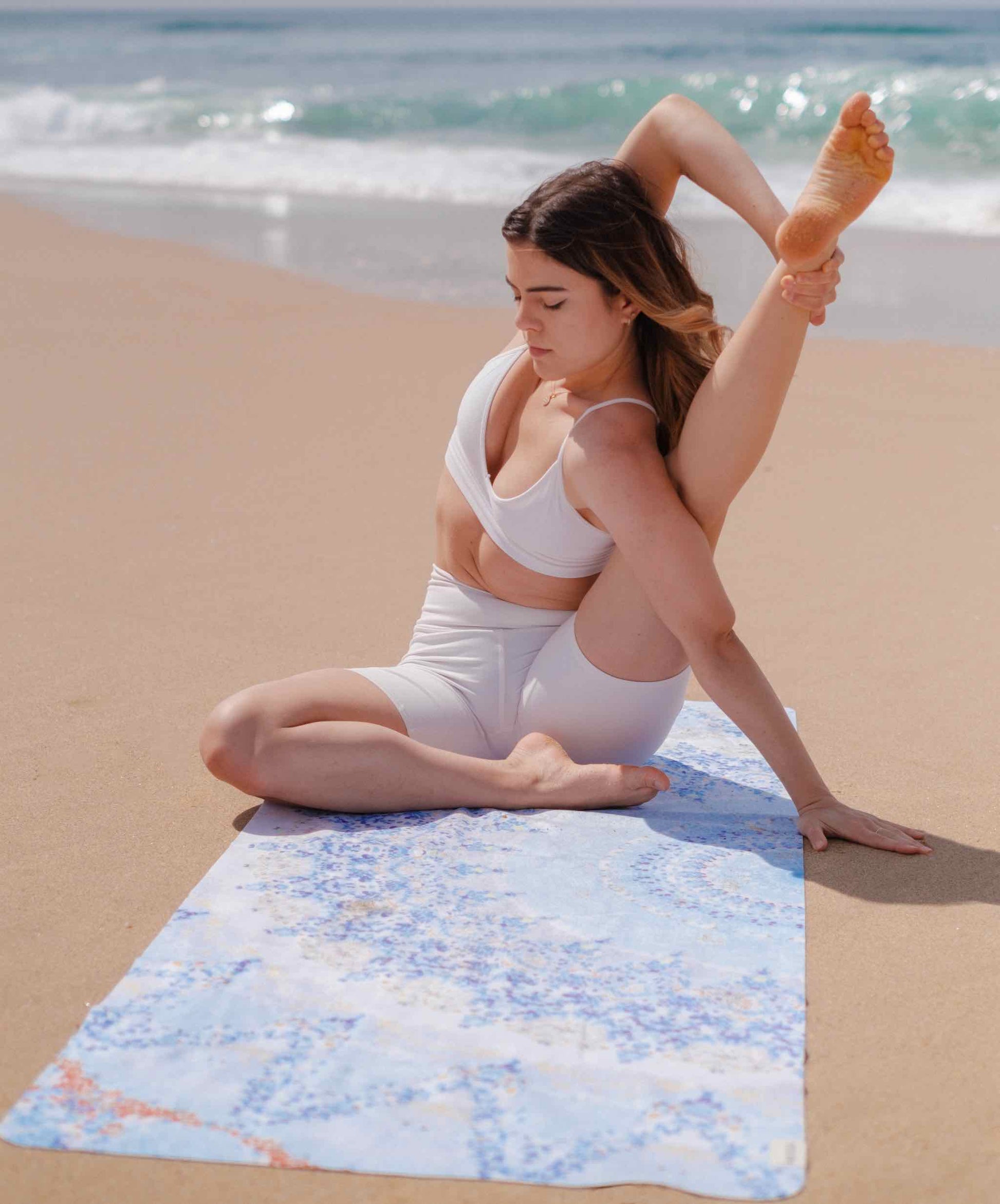 Ultralight Travel Yoga Mat-Women Doing Leg Stretches On Beach-Mikkoa Finding Nirvana Travel Yoga Mat